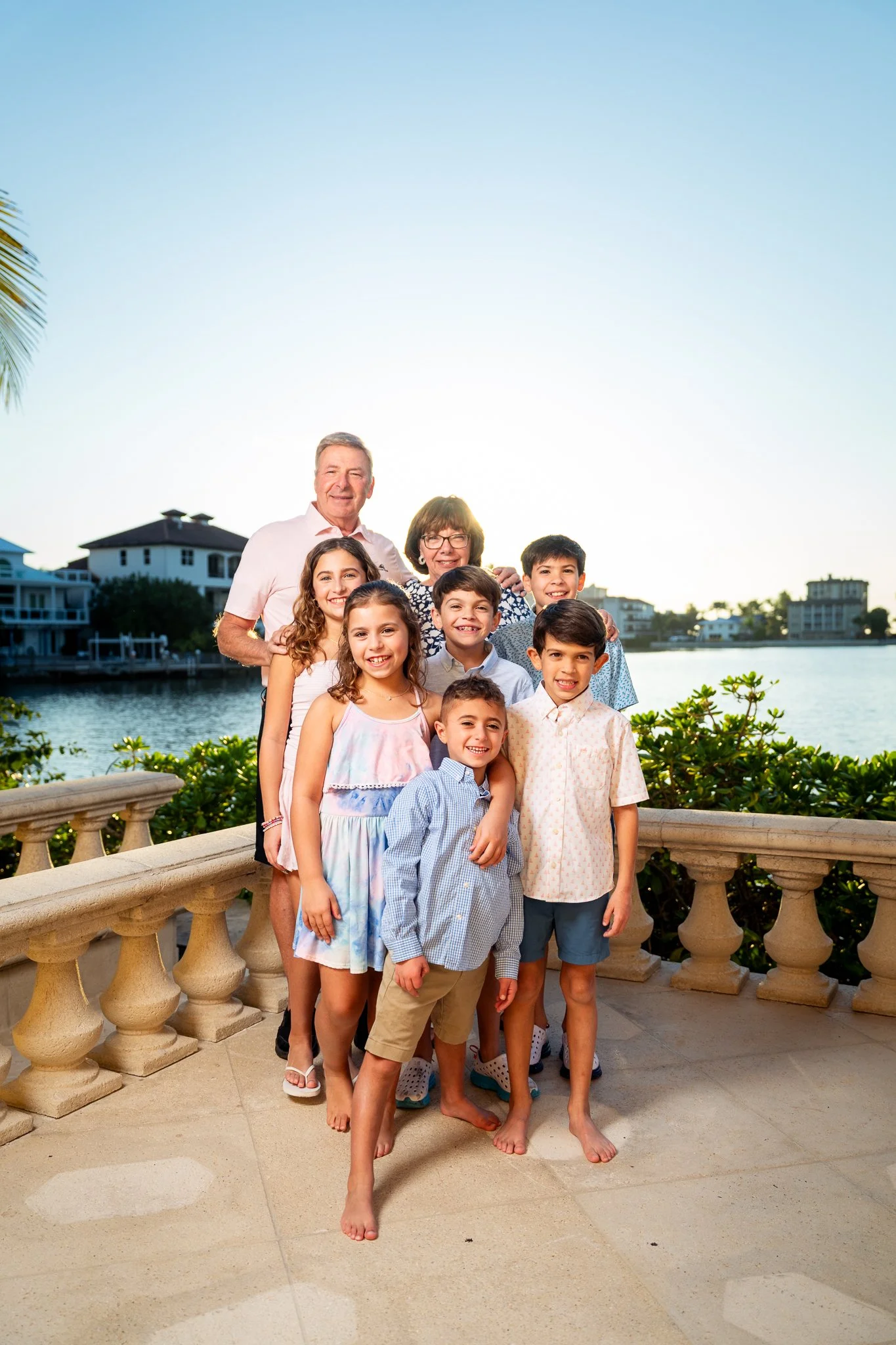 Family portrait on a waterfront terrace